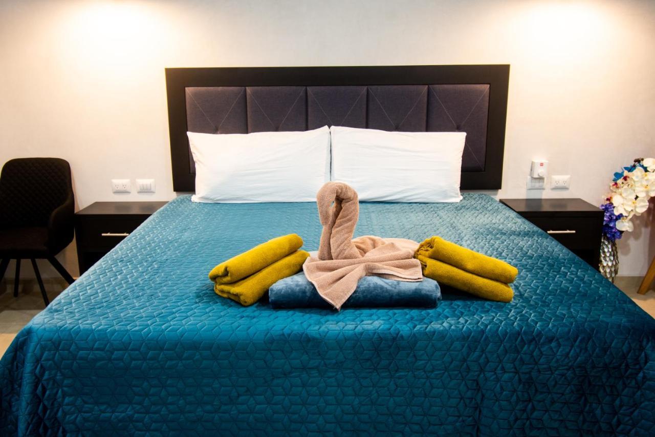 Hotel Casa Tortuga Tulum - Cenotes Park Inclusive ภายนอก รูปภาพ A bed with a towel swan